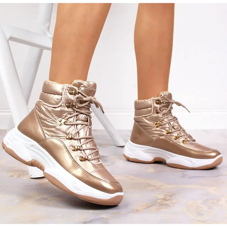 HOGE GEïSOLEERDE GOUDEN VINCEZASPORTSCHOENEN VOOR DAMES